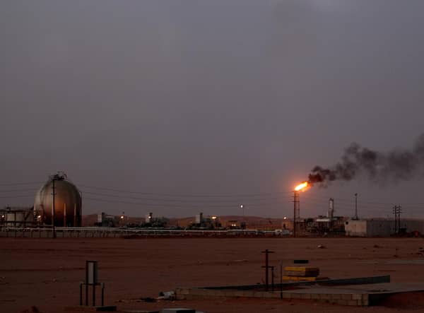 A flame sends smoke billowing into the sky at a Saudi Aramco oil installation in Al-Khurais, Saudi Arabia (Picture: Marwan Naamani/AFP via Getty Images)