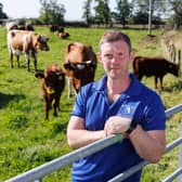 Bryce Cunningham, farmer and owner of Mossgiel Organic Farm near Mauchline is pictured in a field with some of his herd of Ayrshire cows.