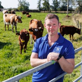 Bryce Cunningham, farmer and owner of Mossgiel Organic Farm near Mauchline is pictured in a field with some of his herd of Ayrshire cows.