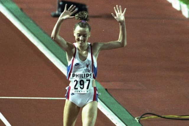 30 Aug 1991:  Liz McColgan of Great Britain celebrates as she crosses the line to win the gold medal in the Womens 10,000 metres event during the World Championships at the Olympic Stadium in Tokyo. \ Mandatory Credit: Tony  Duffy/Allsport