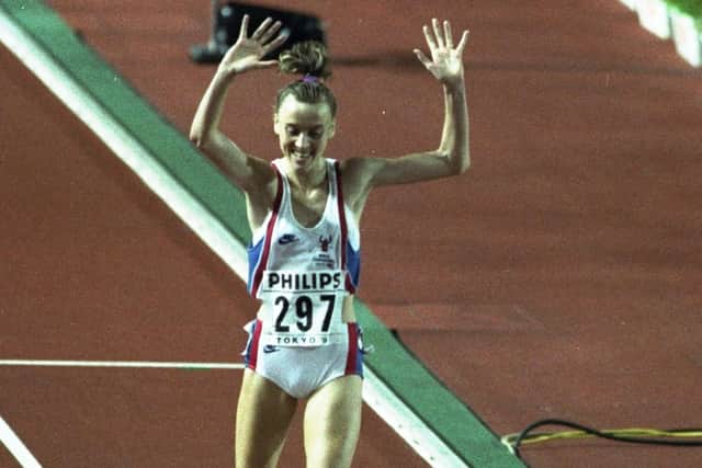 30 Aug 1991: Liz McColgan of Great Britain celebrates as she crosses the line to win the gold medal in the Womens 10,000 metres event during the World Championships at the Olympic Stadium in Tokyo. \ Mandatory Credit: Tony Duffy/Allsport