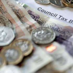 Money stacked on top of a council tax bill. PIC: Danny Lawson/PA Wire