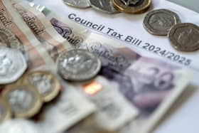 Money stacked on top of a council tax bill. PIC: Danny Lawson/PA Wire