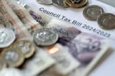 Money stacked on top of a council tax bill. PIC: Danny Lawson/PA Wire