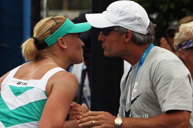 Congratulating daugher Elena after a win in the 2010 Australian Open.
