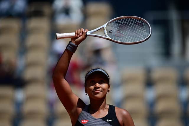 Naomi Osaka celebrates after winning against Romania's Patricia Maria Tig in the first round at the French Open. The Japanese player has now withdrawn.