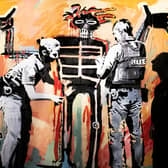 'Basquiat being stop and searched' (London 2017) on display at the new show by street Banksy 'Cut & Run' opens this Sunday at Glasgow's GoMA