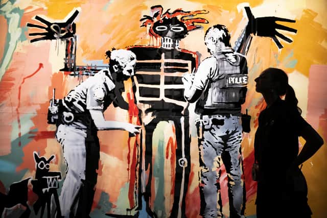 'Basquiat being stop and searched' (London 2017) on display at the new show by street Banksy 'Cut & Run' opens this Sunday at Glasgow's GoMA