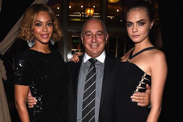 Beyonce Knowles, Sir Philip Green and Cara Delevingne at the Topshop Topman New York City flagship opening dinner in 2014 (Photo: Dimitrios Kambouris/Getty Images)