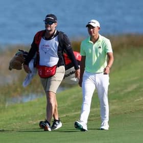 Collin Morikawa and caddie J.J. Jakovac pictured during the third round of the Hero World Challenge at Albany Golf Course in Nassau, Bahamas. Picture: Mike Ehrmann/Getty Images.
