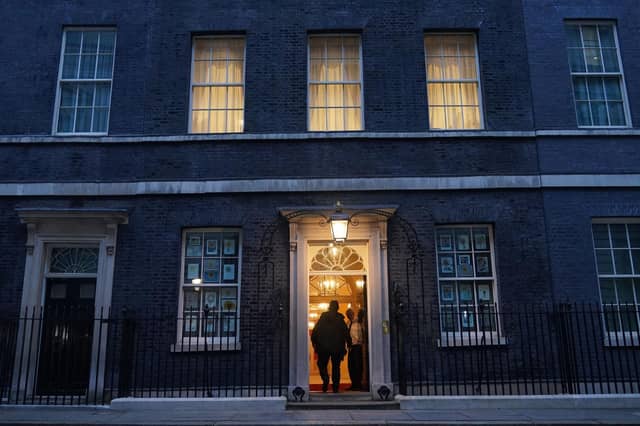 A police officer outside 10 Downing Street. Prime Minister Boris Johnson and Chancellor Rishi Sunak have been told they will be fined as part of a police probe into allegations of lockdown parties