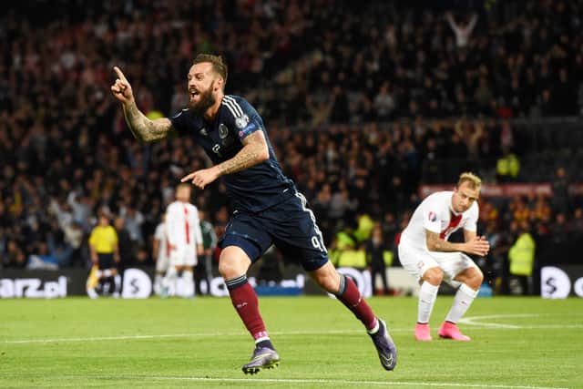 Steven Fletcher wheels away to celebrate after scoring v Poland in 2015. He is a fan of new Scotland recruit Jacob Brown, a teammate at Stoke City