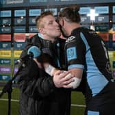 Warriors hooker Johnny Matthews wins the man of the match award and receives a kiss from captain Ryan Wilson after his hat-trick against Zebre. (Photo by Craig Williamson / SNS Group)