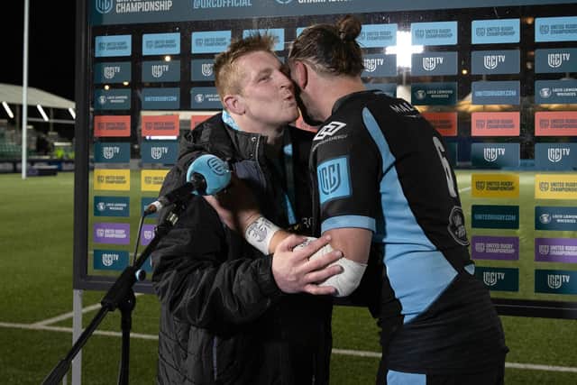 Warriors hooker Johnny Matthews wins the man of the match award and receives a kiss from captain Ryan Wilson after his hat-trick against Zebre. (Photo by Craig Williamson / SNS Group)
