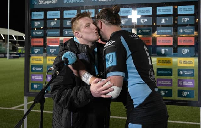 Warriors hooker Johnny Matthews wins the man of the match award and receives a kiss from captain Ryan Wilson after his hat-trick against Zebre. (Photo by Craig Williamson / SNS Group)