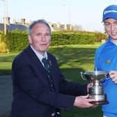 Glenbervie's Graeme Robertson, right, is presented with the trophy by club captain at the time, George Hunter, after his win in the 2016 Craigmillar Park Open.