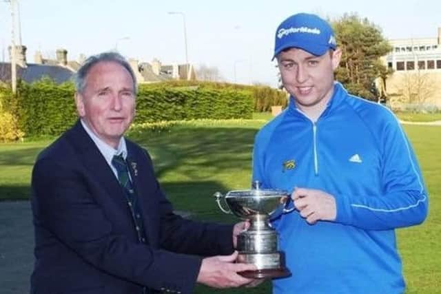 Glenbervie's Graeme Robertson, right, is presented with the trophy by club captain at the time, George Hunter, after his win in the 2016 Craigmillar Park Open.