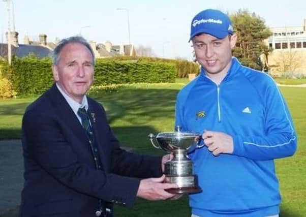 Glenbervie's Graeme Robertson, right, is presented with the trophy by club captain at the time, George Hunter, after his win in the 2016 Craigmillar Park Open.