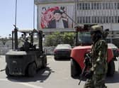 A Taliban soldier patrols at Hamid Karzai International Airport in Kabul, Afghanistan. Picture: AP Photo/Wali Sabawoon