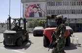 A Taliban soldier patrols at Hamid Karzai International Airport in Kabul, Afghanistan. Picture: AP Photo/Wali Sabawoon