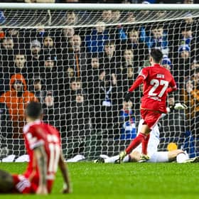 Rafa Silva tucks home Rangers' winner against Benfica at Ibrox.