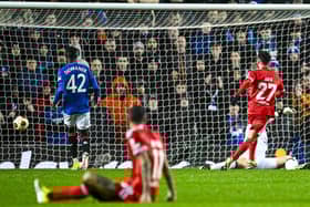 Rafa Silva tucks home Rangers' winner against Benfica at Ibrox.