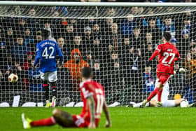 Rafa Silva tucks home Rangers' winner against Benfica at Ibrox.