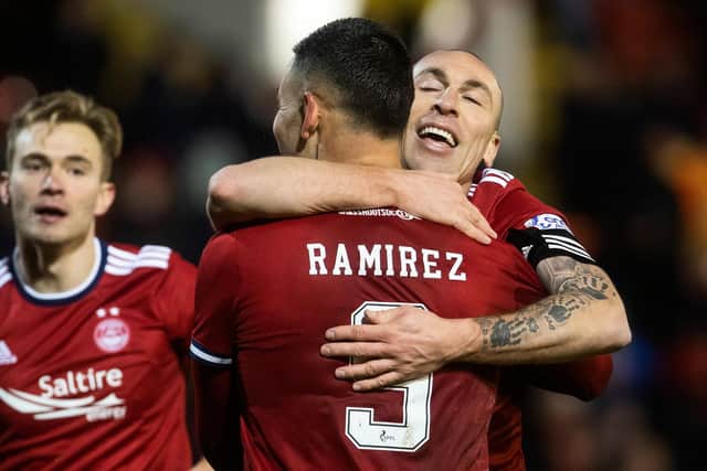 Christian Ramirez celebrates with Scott Brown after scoring to make it 4-1 for Aberdeen.