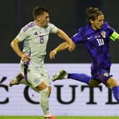 Billy Gilmour tries to get to grips with Luka Modric as Scotland fell to their latest defeat, this time against Croatia on Saturday (Photo by Srdjan Stevanovic/Getty Images)