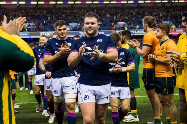 Australia's players applaud as the Scotland team are led off the pitch by debutant try-scorer Ewan Ashman. (Photo by Ross Parker / SNS Group)