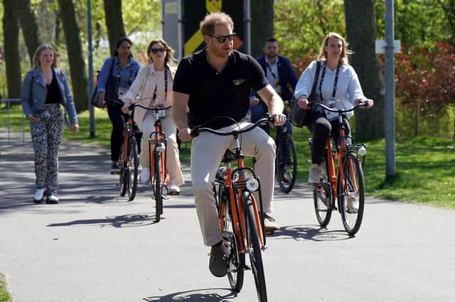 The Duke of Sussex cycles through Zuiderpark during the Invictus Games at the Zuiderpark, in The Hague, Netherlands.