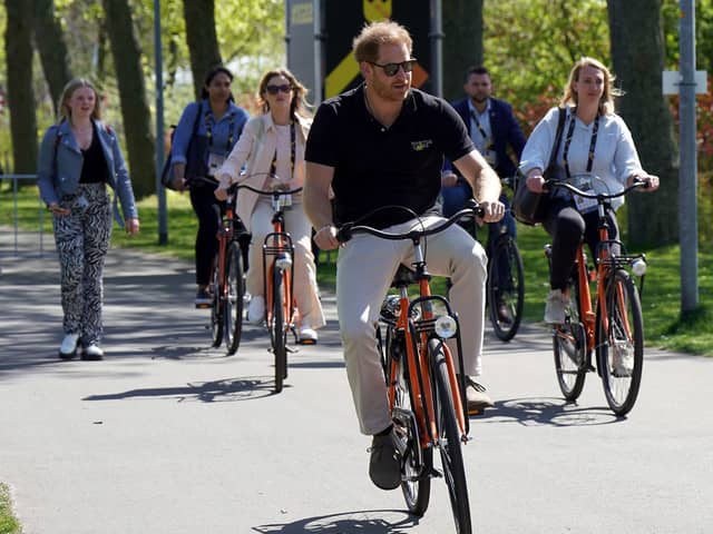 The Duke of Sussex cycles through Zuiderpark during the Invictus Games at the Zuiderpark, in The Hague, Netherlands.