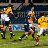 Bevis Mugabi heads home Motherwell's winner against Ross County.