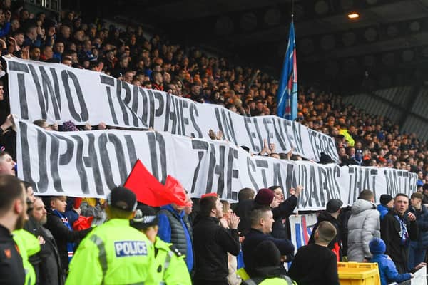 Rangers fans hold up a banner which reads 'Two trophies in eleven years uphold the standards that matter' during the match at Livingston. (Photo by Craig Foy / SNS Group)