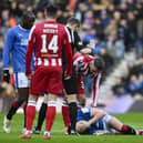 Rangers' Ryan Jack goes down with an injury after the challenge that earned St Johnstone's Nicky Clark a red card.  (Photo by Rob Casey / SNS Group)