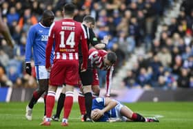 Rangers' Ryan Jack goes down with an injury after the challenge that earned St Johnstone's Nicky Clark a red card.  (Photo by Rob Casey / SNS Group)