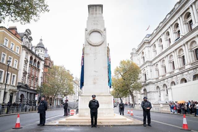 Officers from the Metropolitan Police on duty beside the Cenotaph in Whitehall, central London, ahead of marches planned for the centre of the city on Saturday - Armistice Day. Picture: Stefan Rousseau/PA Wire