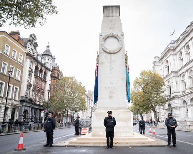 Officers from the Metropolitan Police on duty beside the Cenotaph in Whitehall, central London, ahead of marches planned for the centre of the city on Saturday - Armistice Day. Picture: Stefan Rousseau/PA Wire