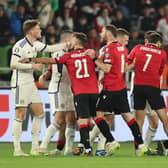 Scotland's Scott McTominay (L) argues with Georgia players during the 2-2 draw in Tiblisi. (Photo by GIORGI ARJEVANIDZE/AFP via Getty Images)