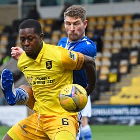 Marvin Bartley holds off St Johnstone's David Wotherspoon as Livingston succumbed to their first defeat under manager David Martindale  (Photo by Sammy Turner / SNS Group)