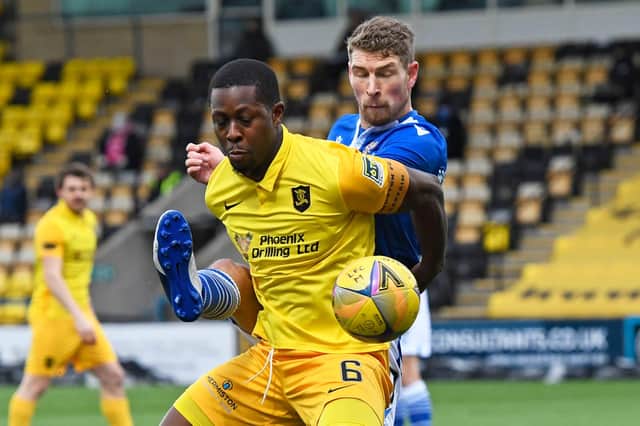 Marvin Bartley holds off St Johnstone's David Wotherspoon as Livingston succumbed to their first defeat under manager David Martindale  (Photo by Sammy Turner / SNS Group)