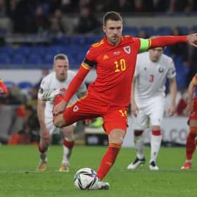 Wales' midfielder Aaron Ramsey scores their third goal from the penalty spot during the FIFA World Cup 2022 Group E qualifier football match between Wales and Belarus at Cardiff City Stadium. (Photo by Geoff Caddick / AFP) (Photo by GEOFF CADDICK/AFP via Getty Images)