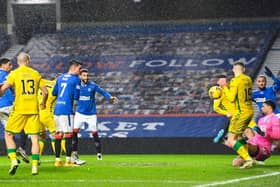 Hibs goalkeeper Dillon Barnes saves an effort from Rangers' Leon Balogun during the close encounter at Ibrox. Photo by Rob Casey/SNS Group