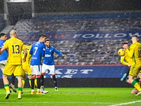 Hibs goalkeeper Dillon Barnes saves an effort from Rangers' Leon Balogun during the close encounter at Ibrox. Photo by Rob Casey/SNS Group