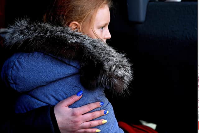 A young Ukrainian fleeing her home country in March this year. More than 20,000 Ukrainians have arrived in Scotland under the government's super sponsor scheme, with challenges now being faced over housing and paperwork, write Steven Lynch and Maisie Wilson of Ukraine Advice Scotland. PIC: Darek Delmanowicz/EPA-EFE/Shutterstock (12846944k)