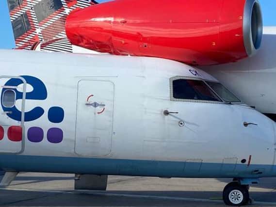 The former Flybe plane after its collision with the Loganair aircraft. Picture: @_Alpha_Delta.