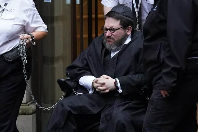 Rape suspect Nicholas Rossi leaving Edinburgh Sheriff and Justice of the Peace Court after an extradition hearing. (Photo credit: Andrew Milligan/PA Wire)