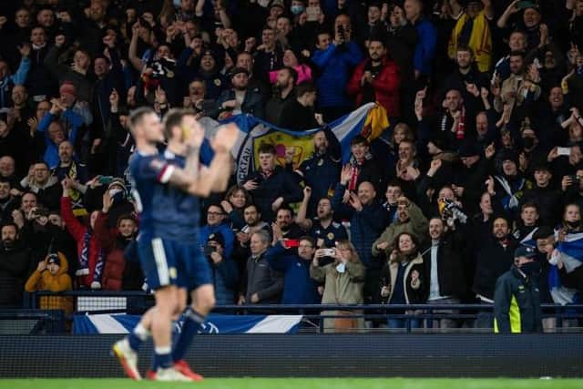 Scotland players applaud the fans at full time during a FIFA World Cup Qualifier between Scotland and Denmark. Future games will be streamed on a new service from 2024. (Photo by Craig Foy / SNS Group)