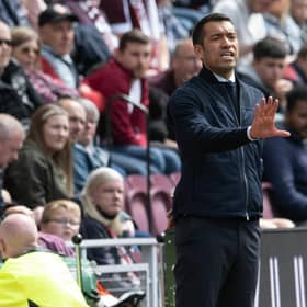 Rangers manager Giovanni van Bronckhorst issues instructions from the sidelines.