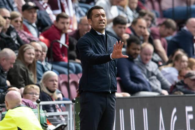 Rangers manager Giovanni van Bronckhorst issues instructions from the sidelines.